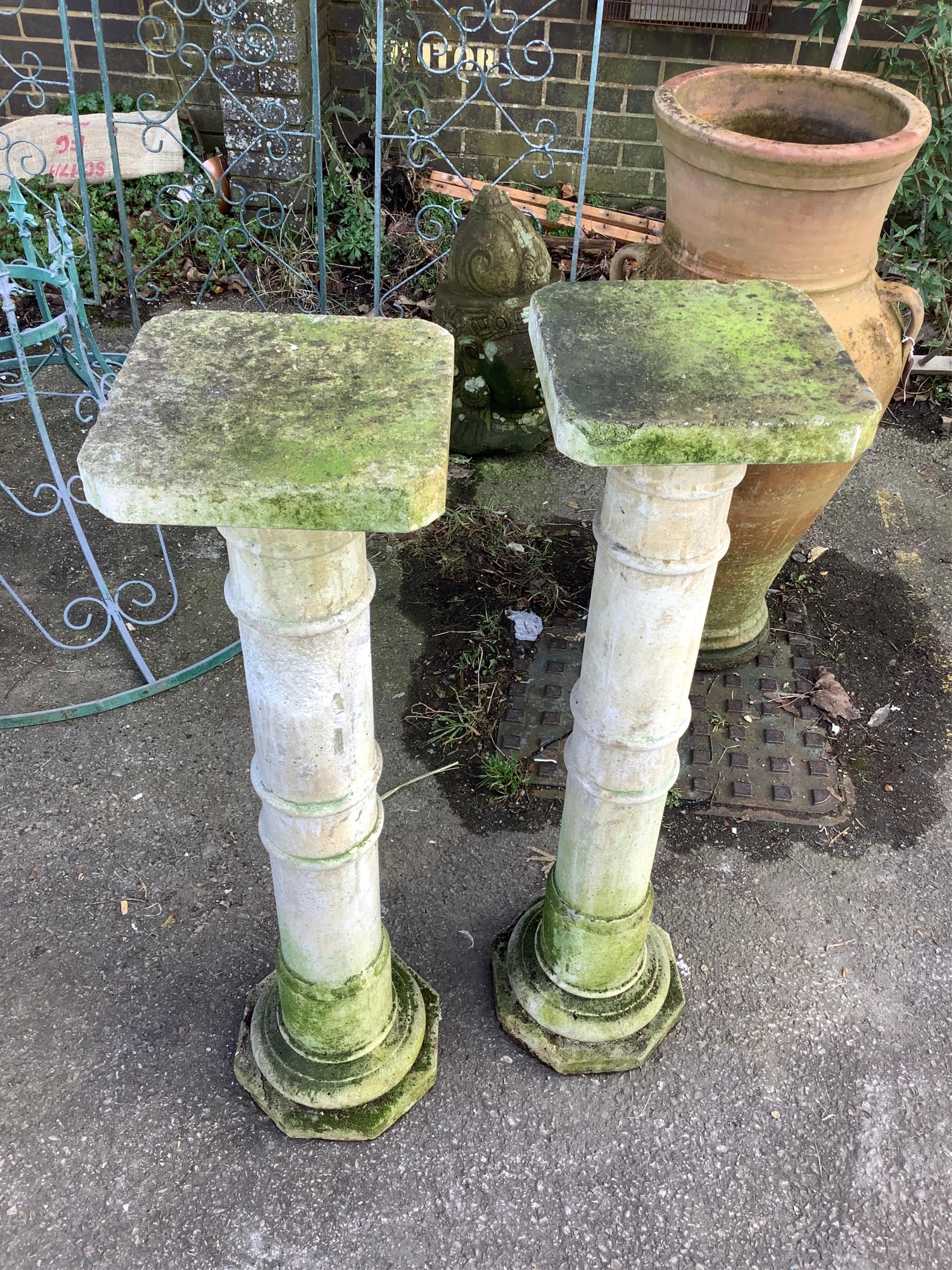 A pair of reconstituted stone garden pedestals, height 99cm. Condition - fair